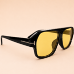 Bold square unisex sunglasses with glossy black frame and Amber Gold polarised lens