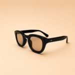 Round unisex sunglasses from NeXova UK with glossy black frame and warm brown lenses