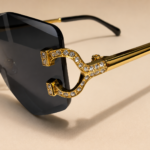 Rimless geometric sunglasses from NeXova UK with smoke grey lenses and gold-tone frame details