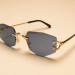 Rimless geometric sunglasses from NeXova UK with smoke grey lenses and gold-tone frame details