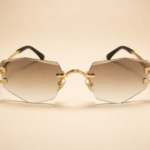 Rimless geometric sunglasses from NeXova UK with brown gradient lenses and gold-tone frame details
