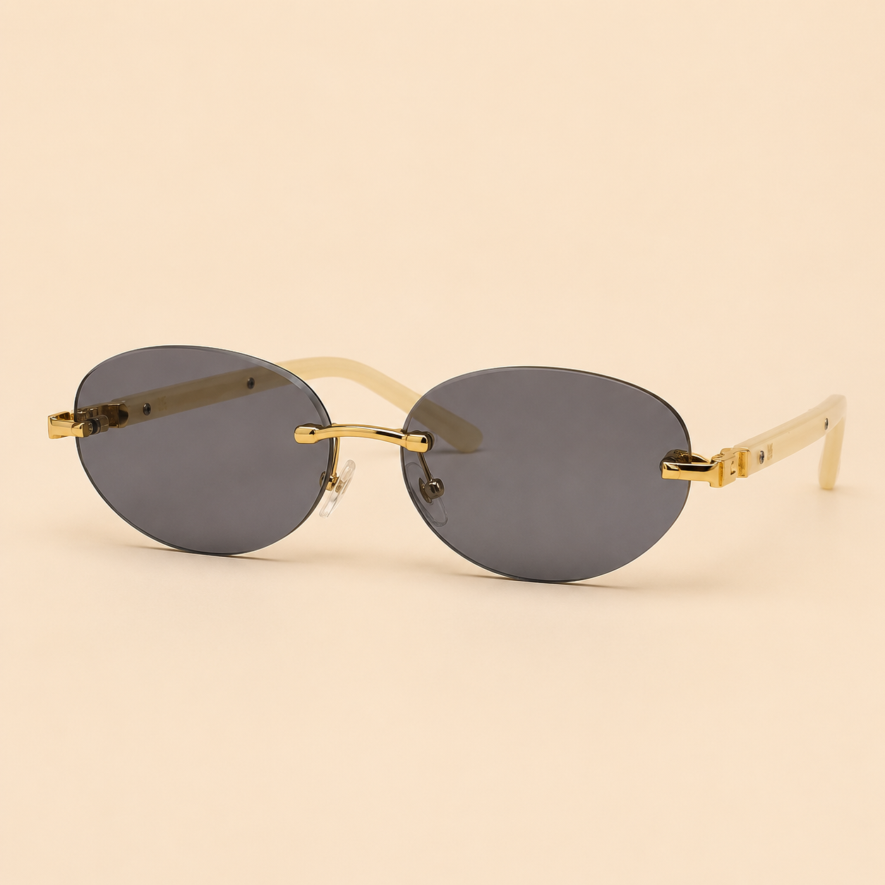 Rimless oval unisex sunglasses from NeXova UK with smoke grey lenses, gold-tone bridge and cream temples