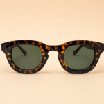 Round unisex sunglasses from NeXova UK with tortoiseshell frame and green lenses
