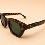 Round unisex sunglasses from NeXova UK with tortoiseshell frame and green lenses