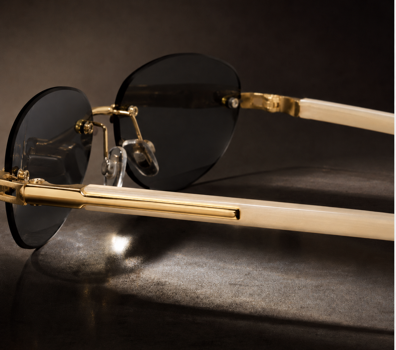 Rimless oval unisex sunglasses from NeXova UK with blacklenses, gold-tone bridge and cream temples