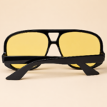 Oversized aviator unisex sunglasses from NeXova UK with glossy black frame and yellow tinted lenses