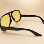 Oversized aviator unisex sunglasses from NeXova UK with glossy black frame and yellow tinted lenses